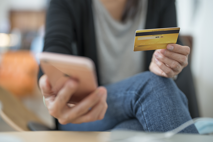 woman holding credit card