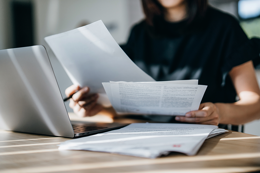 woman looking at papers