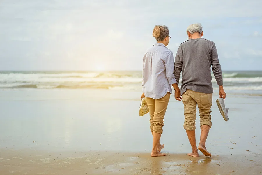 retired couple on beach